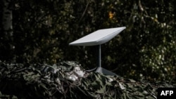 FILE - An antenna of the Starlink satellite-based broadband system donated by the U.S. tech billionaire Elon Musk is seen in Izyum, Kharkiv region, Sept. 25, 2022, amid Russia's invasion of Ukraine.