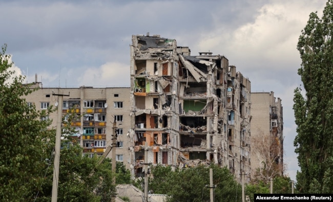 FILE - A view shows apartment buildings damaged during Ukraine-Russia conflict in the town of Popasna in the Luhansk region, Ukraine July 14, 2022. (REUTERS/Alexander Ermochenko)