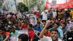 Bangladesh Nationalist Party activists shout slogans in Dhaka, Oct. 28, 2023. Party members want the resignation of Prime Minister Sheikh Hasina and the transfer of power to a nonpartisan caretaker to oversee general elections next year.