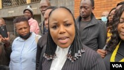 Fadzayi Mahere, the spokeswoman for the main opposition party, the Citizens' Coalition for Change, talks to journalists outside Harare Magistrate Courts, May 23, 2023. (Columbus Mavhunga/ VOA)