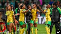Jamaican players celebrate at the end of the Women's World Cup Group F soccer match between Panama and Jamaica in Perth, Australia, July 29, 2023. Jamaica won 1-0.