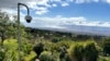 FILE - A fire-detection camera overlooks a neighborhood on July 18, 2024, in Kula, Hawaii. 