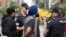 Police arrest a Sikh protester during a demonstration for the independence of Khalistan in front of the Indian Consulate in Toronto, Canada, on July 8, 2023.
