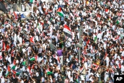 Iraqis hold a mass rally supporting the Palestinians in the Gaza Strip, Oct. 13, 2023., in Baghdad, Iraq.