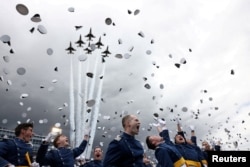 U.S. Air Force jets fly overhead as USAF Academy graduates celebrate at Falcon Stadium in Air Force Academy, Colo., June 1, 2023.