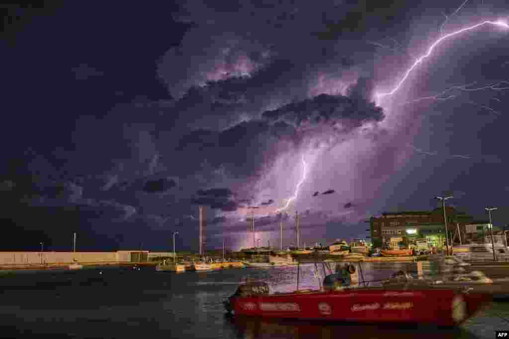 Lightning is across the night sky over the coastal port city of Batroun, 43 kilometers north of the Lebanese capital Beirut.