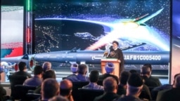 Iranian President Ebrahim Raisi speaks during the unveiling ceremony of the new ballistic missile called 