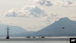 Rescuers work in the area where the British-flagged vessel Bayesian that was hit by a violent sudden storm, sunk early Aug. 19, 2024, while at anchor off the Sicilian village of Porticello, near Palermo, in southern Italy.