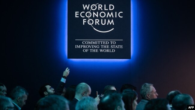FILE - Participants are seen during a session of the annual World Economic Forum in Davos, Switzerland, Jan. 17, 2023. The Alpine resort will host this year's World Economic Forum from Jan. 15 through Jan. 19, 2024.