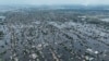 FILE - Houses are submerged in the town of Oleshky, Ukraine, June 10, 2023, from the destruction of the Kakhovka Dam on June , on the Dnipro River in Ukraine. 