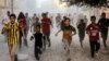 Palestinian children run as they flee from Israeli bombardment in Rafah in the southern Gaza Strip on Nov. 6, 2023.