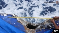 FILE - Damage to the Philippine coast guard ship Cape Engano is seen following a collision with a Chinese coast guard vessel near Sabina Shoal in the South China Sea, in this handout photo taken by the Philippine Coast Guard on Aug. 19, 2024.