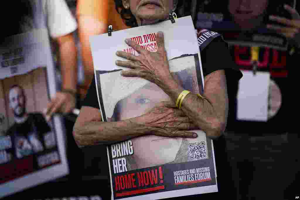 Relatives and friends of those kidnapped during the October 7 Hamas cross-border attack in Israel hold photos of their loved ones during a protest calling for their return outside the Knesset, Israel&#39;s parliament in Jerusalem.&nbsp;On October 7, about 240 were taken hostage and 1,400 were killed in the attack by Hamas militants in Israel.&nbsp;