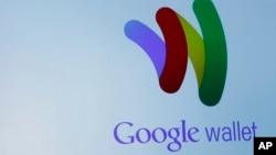 The Google Wallet logo is on display during a news conference, Thursday, May 26, 2011, in New York. (AP Photo/Mary Altaffer)