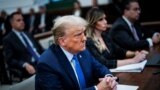 FILE — Former U.S. President Donald Trump attends the Trump Organization civil fraud trial in New York, Nov. 6, 2023. A U.S. judge on Friday said Trump does not have immunity from criminal charges for actions he took as president.