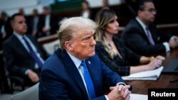 FILE — Former U.S. President Donald Trump attends the Trump Organization civil fraud trial in New York, Nov. 6, 2023. A U.S. judge on Friday said Trump does not have immunity from criminal charges for actions he took as president.