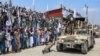 Personel keamanan Taliban menunjukkan keterampilan mereka mengendarai kendaraan militer selama parade dalam perayaan ulang tahun ketiga Taliban berkuasa di Khost, 14 Agustus 2024. (AFP)