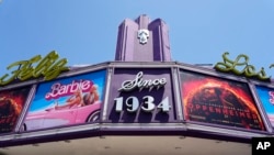 FILE - The marquee of the Los Feliz Theatre features the films "Barbie" and "Oppenheimer' on July 28, 2023, in Los Angeles. Both films were blockbusters in 2023.