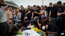 Mourners gather around the grave of Staff Sergeant Lavi Lipshitz during his funeral in Jerusalem, Nov. 1, 2023. Lipshitz was killed during a ground operation in the Gaza Strip as Israel presses ahead with its war against Hamas militants.