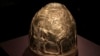 FILE - A Scythian gold helmet from the fourth century B.C. is displayed as part of an exhibit called Crimea - Gold and Secrets of the Black Sea, at the Allard Pierson historical museum in Amsterdam, April 4, 2014. The collection has now made its way back to Ukraine.