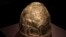 FILE - A Scythian gold helmet from the fourth century B.C. is displayed as part of an exhibit called Crimea - Gold and Secrets of the Black Sea, at the Allard Pierson historical museum in Amsterdam, April 4, 2014. The collection has now made its way back to Ukraine.