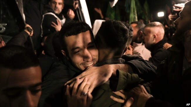 A man is welcomed after being released from prison by Israel, in the West Bank town of Ramallah, Nov. 30, 2023.