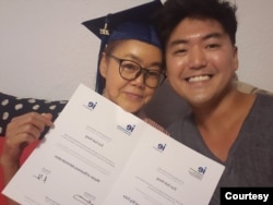 Eun Suk “Jason” Hong, a former DACA recipient, poses with his mother in Spain when he graduated with a master's degree in business analytics and big data. (Photo courtesy of Eun Suk Hong)