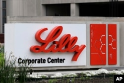 FILE - A sign for Eli Lilly & Co. sits outside their corporate headquarters in Indianapolis on April 26, 2017. (AP Photo/Darron Cummings, File)