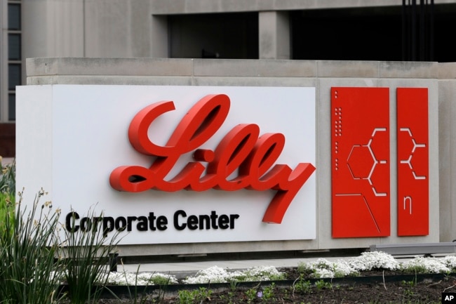 FILE - A sign for Eli Lilly & Co. sits outside their corporate headquarters in Indianapolis on April 26, 2017. (AP Photo/Darron Cummings, File)