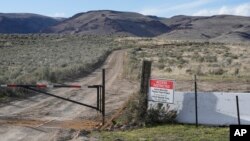 FILE - An 'Access Restricted' sign is displayed at the Lithium Nevada Corp. mine site at Thacker Pass on April 24, 2023, near Orovada, Nev.