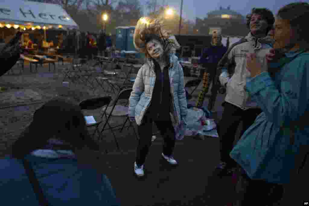 Climate activist Greta Thunberg dances after addressing tens of thousands of people who marched through Amsterdam, Netherlands, to call for more action to tackle climate change.