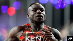 FILE - Ferdinand Omanyala, of Kenya, competes in a men's 60 meters heat during the World Athletics Indoor Championships at the Emirates Arena in Glasgow, Scotland, March 1, 2024. 