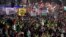 Protester hold flags and placards as they take part in a pro-Palestinian demonstration in London, Nov. 25, 2023. 