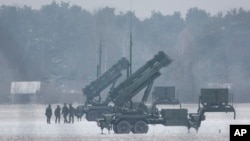 FILE - Patriot missile launchers acquired from the U.S. last year are seen deployed in Warsaw, Poland, Feb. 6, 2023. 