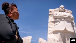FILE - Bernice King, the daughter of Martin Luther King Jr., looks up at his memorial in Washington, Aug. 25, 2023, 60 years after the March on Washington.