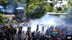 FILE - Police fire tear gas at protesters amid an economic crisis in Colombo, Sri Lanka, on July 13, 2022.