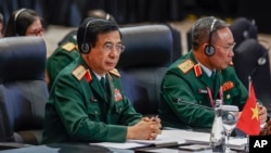 Vietnam's Defense Minister Phan Van Giang, left, attends the Association of Southeast Asian Nations Defense Ministers Meeting in Jakarta, Indonesia, Nov. 15, 2023. Giang is expected in the U.S. in September.