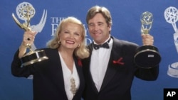 FILE - Actors Gena Rowlands and Beau Bridges hold up their Emmys for Best Actress and Best Actor for Miniseries or Special during the 44th Annual Emmy Awards in Pasadena, Calif., Aug. 30, 1992.