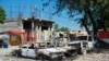 Charred vehicles remain parked as gang violence escalates in Port-au-Prince, Haiti, March 9, 2024.