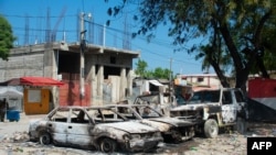 Charred vehicles remain parked as gang violence escalates in Port-au-Prince, Haiti, March 9, 2024.