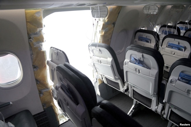 FILE - The fuselage plug area of Alaska Airlines Flight 1282 Boeing 737 Max is seen during its investigation by the National Transportation Safety Board in Portland, Oregon, Jan. 7, 2024. (NTSB/Handout via Reuters)