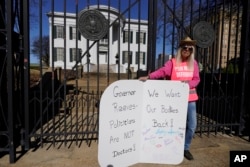 FILE - Derenda Hancock, co-director of the Jackson Women's Health Organization clinic patient escorts, better known as the Pink House defenders, stands before the Mississippi Governor's Mansion in Jackson, Jan. 20, 2023.