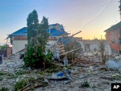 This photo released by the acting governor of Kursk region's Telegram channel on Aug. 6, 2024, shows a damaged house in Sudzha, Kursk region, after shelling by Ukraine forces. Ukraine said Aug. 15, 2024, its military had taken control of the town.