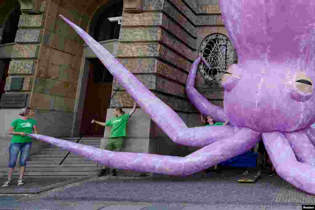 Greenpeace activists stage a protest demanding an end to deep sea mining, in front of the Ministry of Industry in Prague, Czech Republic.