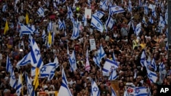 People take part in a protest calling for a deal that would secure the immediate release of remaining hostages held in the Gaza Strip by Hamas, in Tel Aviv, Israel, Sept. 1, 2024. 