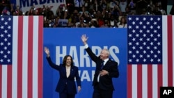 Democratic presidential nominee Vice President Kamala Harris and her running mate Minnesota Gov. Tim Walz arrive at a campaign rally in Philadelphia, Aug. 6, 2024.