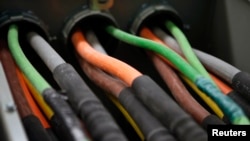 FILE - Fiber optic cables are seen running into a server room at Intergate.Manhattan, a data center owned and developed by Sabey Data Center Properties, during a tour of the facility in lower Manhattan, in New York, March 20, 2013. (REUTERS/Mike Sega)