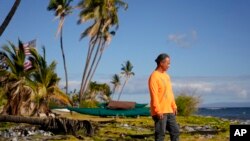 Ekolu Lindsey, who lost the waterfront home where his family has lived for five generations during the August 2023 wildfires, stands for a photo, July 6, 2024, in Lahaina, Hawaii.