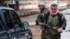 FILE - Christian fighters of Sutoro carry their weapons at a checkpoint in Tel Tamr, Syria, Feb. 25, 2015. Local reports said three members of Sutoro were killed in Turkish drone strikes on Derik, Syria, Feb. 28, 2024.
