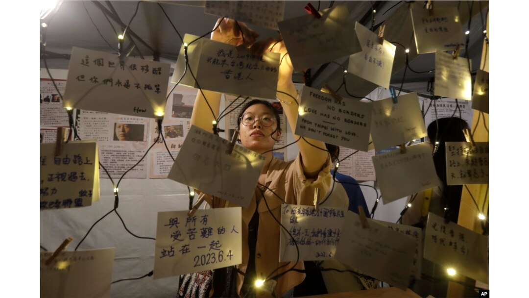 People leave messages during a candlelight vigil at Democracy Square in Taipei, Taiwan, June 4, 2023, to mark the 34th anniversary of the Chinese military crackdown on the pro-democracy movement in Beijing's Tiananmen Square.